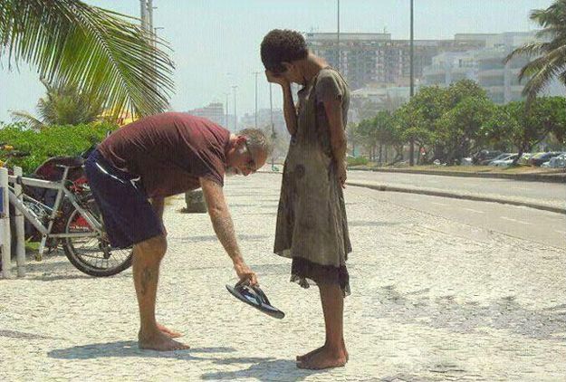 This photograph of a man giving his shoes to a homeless girl in Rio de Janeiro